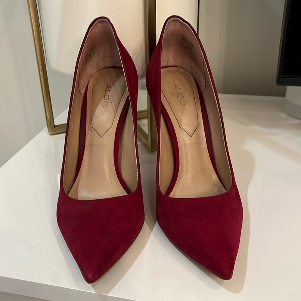 Red Aldo stilettos normal wear and tear.